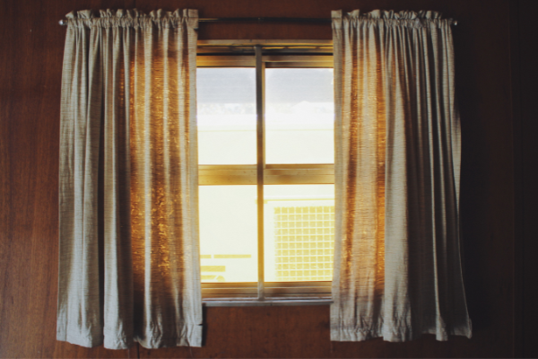 Hang curtains in unlikely places